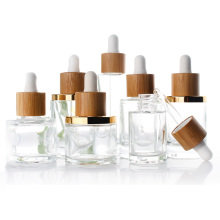 clear 15ml 30ml 50ml round essential oil cosmetic glass dropper bottles with bamboo lid